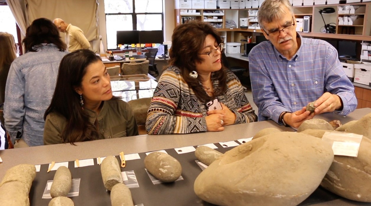 Archaeologist, Brian Byrd holding and showing an artifact collected from the excavation  of Sii Túupentak, a pre-contact Ohlone village in the Sunol Valley of California.